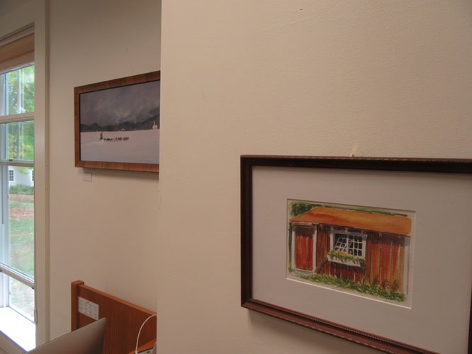 Framed paintings hanging on a wall
