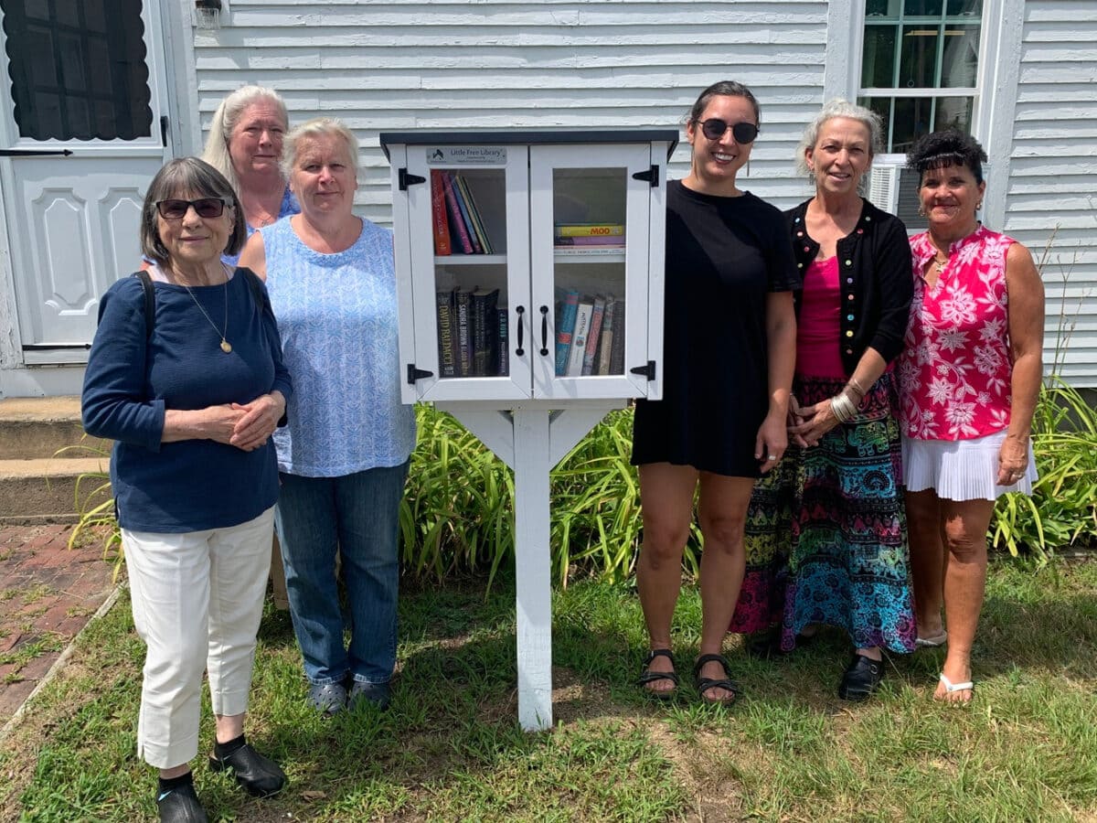 photo of six people standing next to a Little Free Library in South Tamworth