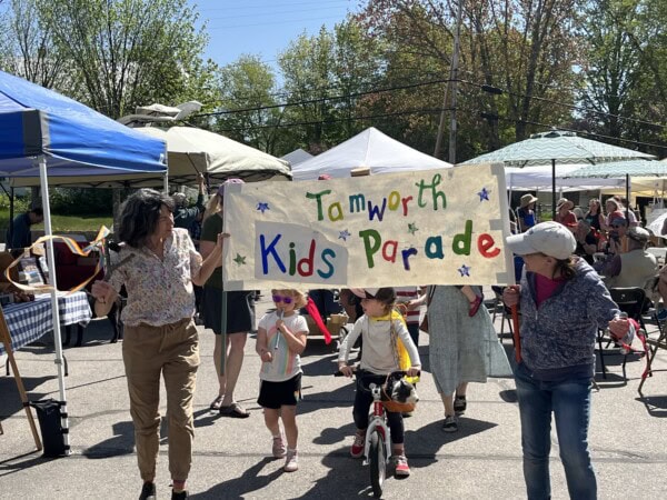 photo of children and adults marching in a children's parade