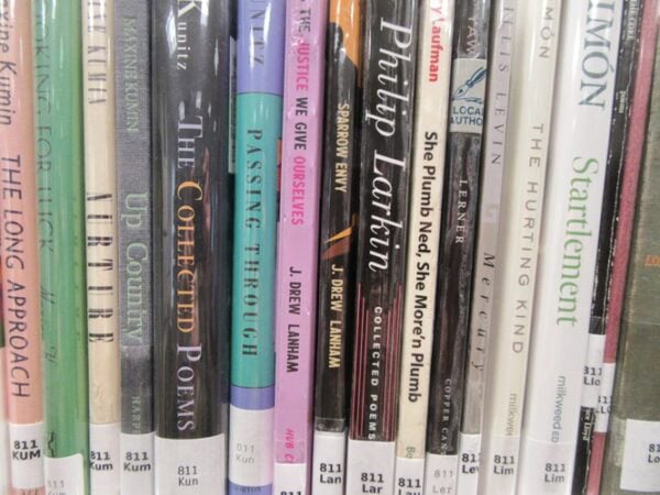 photo of poetry books on a library shelf